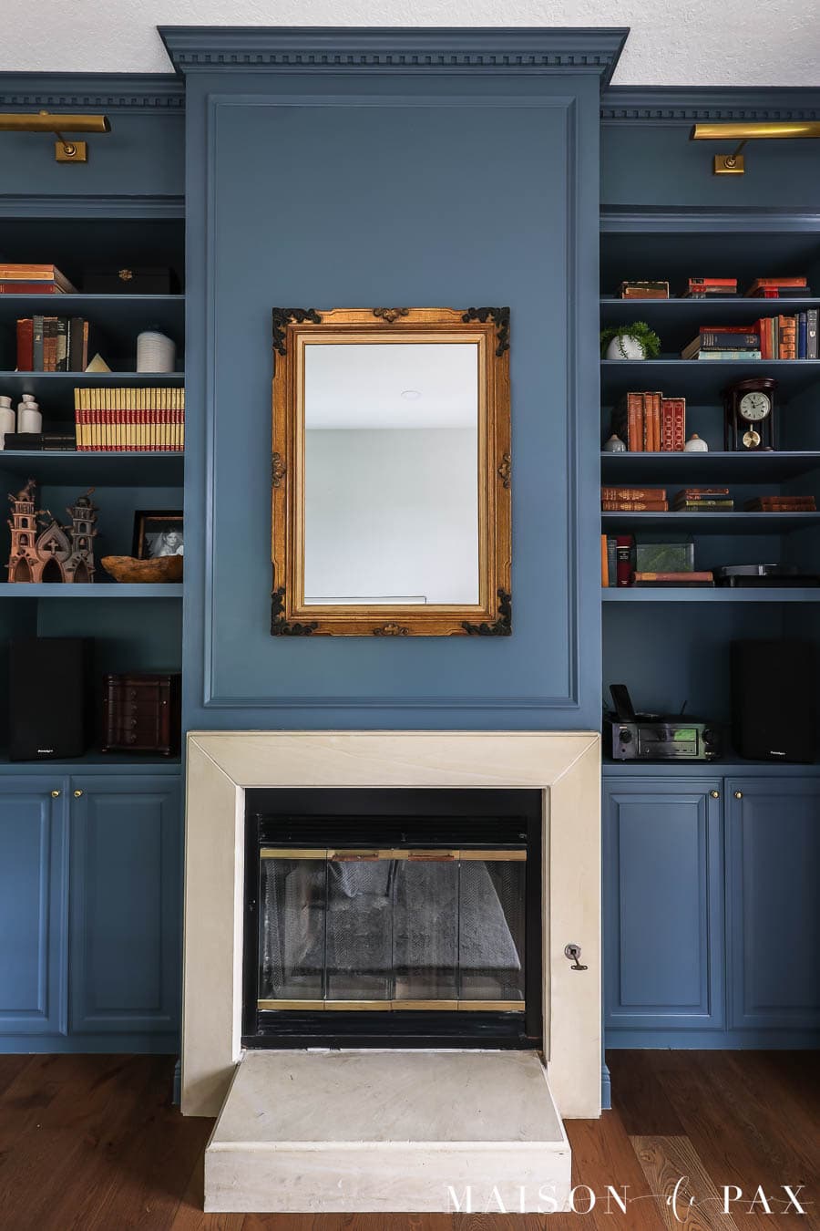 thrifted antique mirror above fireplace