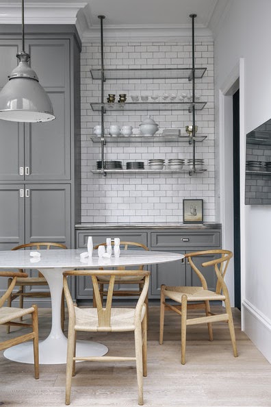 gray cabinets and white subway tile backsplash to ceiling