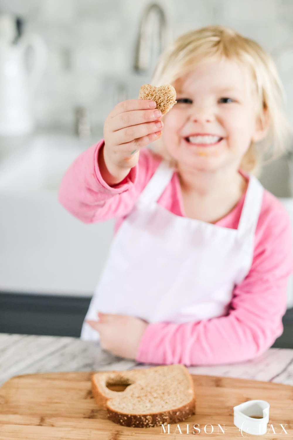 kids making heart shaped french toast with cinnamon and sugar recipe #valentinesrecipe #valentinesbreakfast #hearttoast #frenchtoast