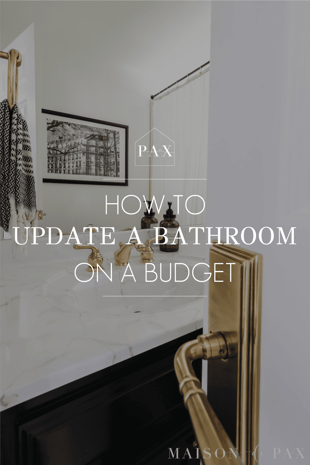 image of an elegant black and white bathroom with text overlay: how to update a bathroom on a budget