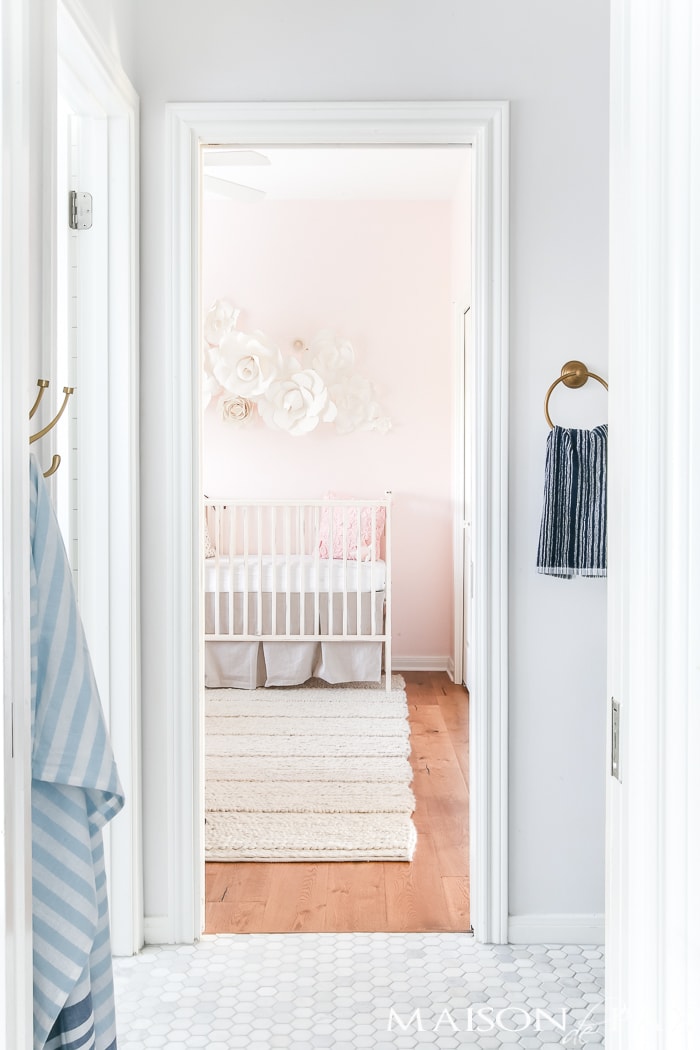 marble white and navy bathroom next to a blush nursery- Maison de Pax
