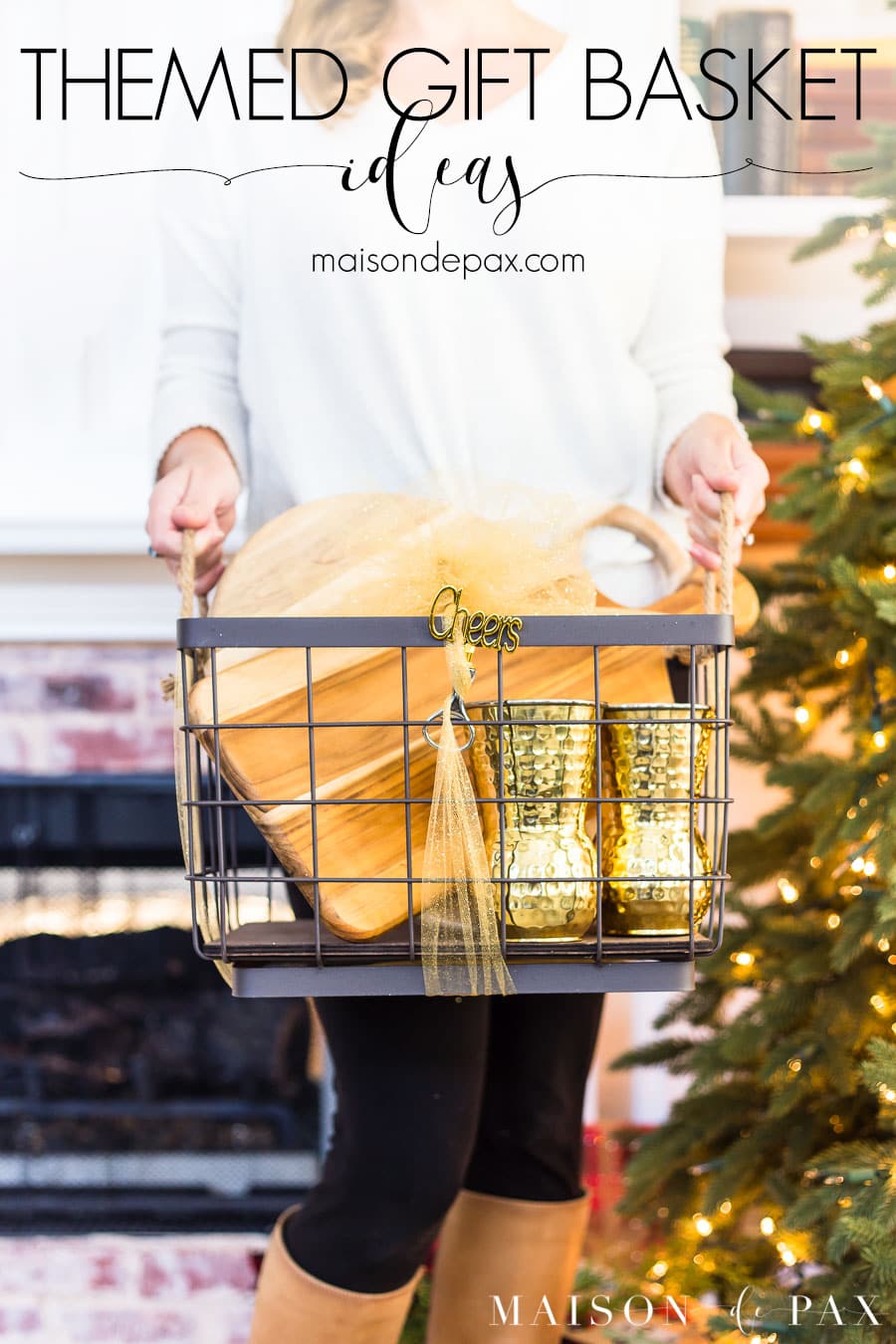 woman holding basket in front of tree with overlay: themed gift basket ideas | Maison de Pax