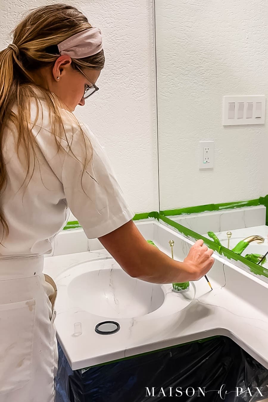 paint gray veins to give countertops a faux Carrara marble look