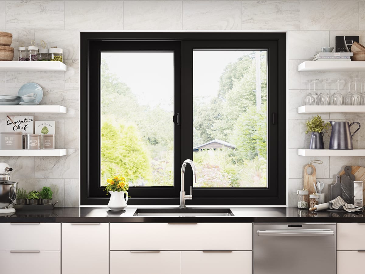 white kitchen with open shelving, black counters, and black window above sink | Maison de Pax