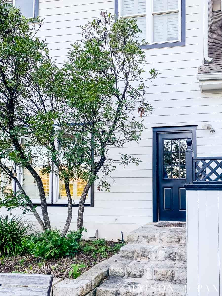 white duck siding with black trim and doors | Maison de Pax