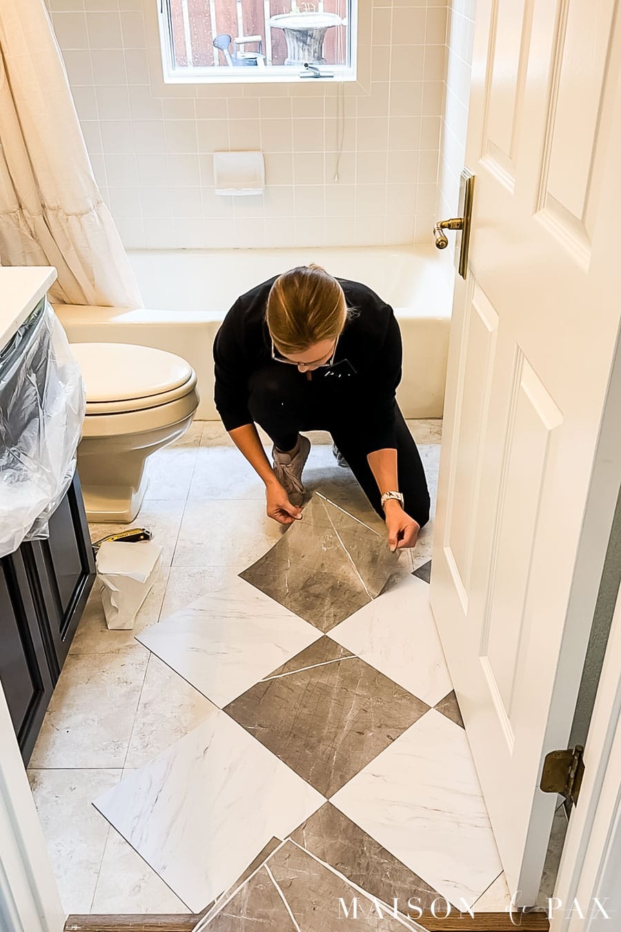 laying peel and stick floor tiles