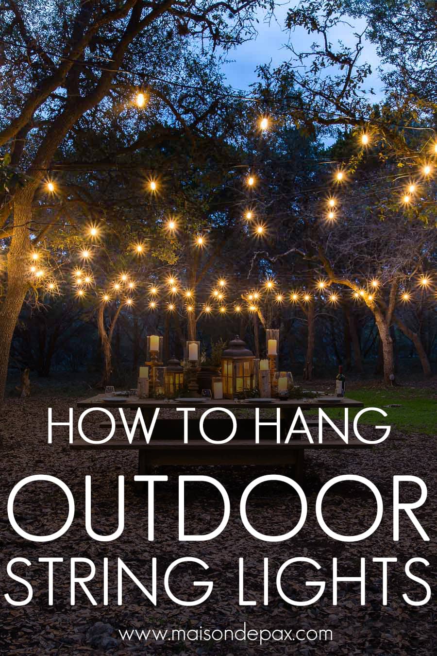gorgeous globe string lights over a picnic table outdoors | Maison de Pax