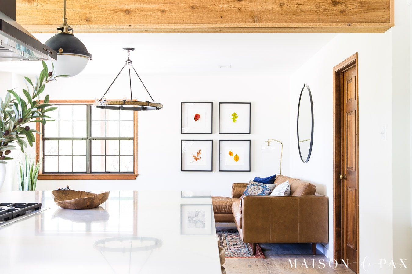 open kitchen living with simple botanical wall art | Maison de Pax