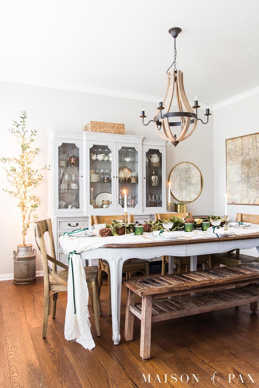 table decorated for holidays with magnolia garland | maison de pax