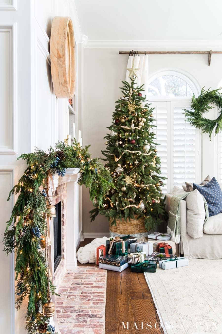 Christmas tree with gold ornaments and wood bead garland
