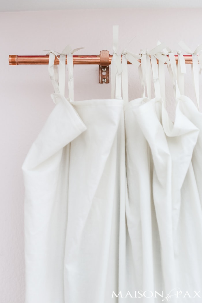 Copper is such a beautiful accent, and curtain rods can be so expensive! These DIY copper curtain rods are both chic and affordable, and they are so so easy to make. Read the full tutorial for how to make copper curtain rods.