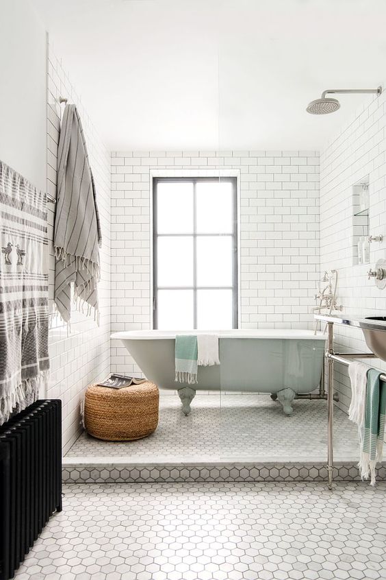 marble hex flooring with white subway tile walls