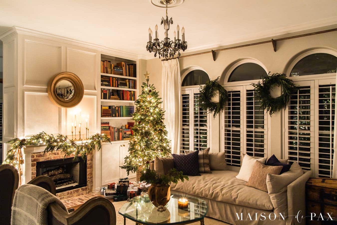 living room all lit up with candlelight and Christmas lights