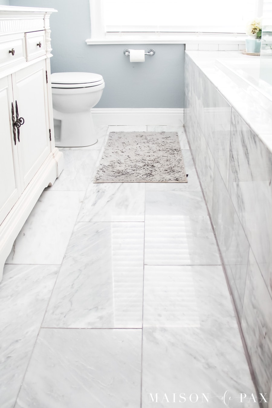 small bathroom with 12x24 marble tiles floor