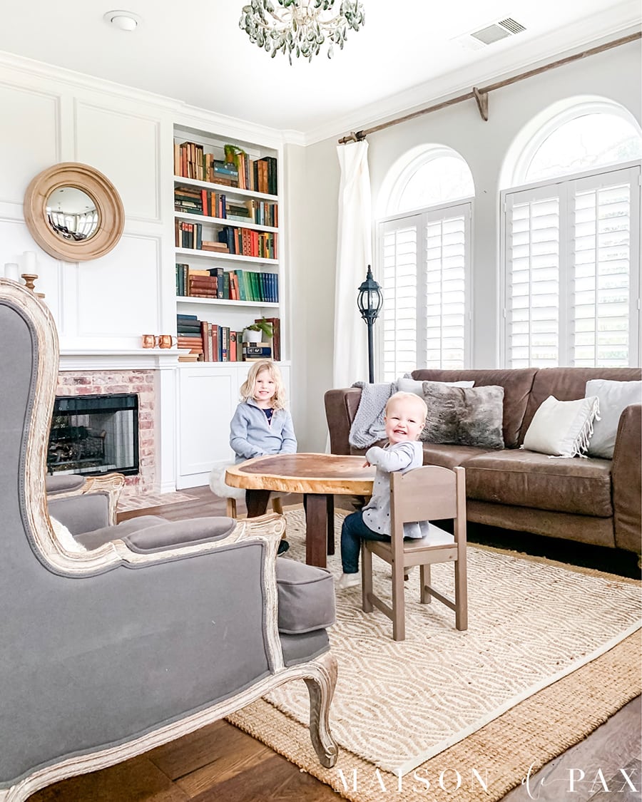 layered neutral rugs in living room | Maison de Pax