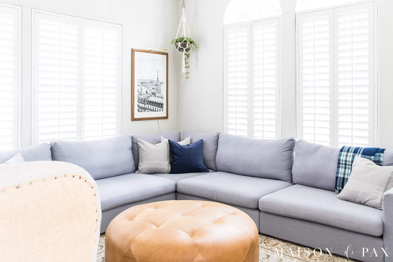 giant gray sectional with navy and gray pillows