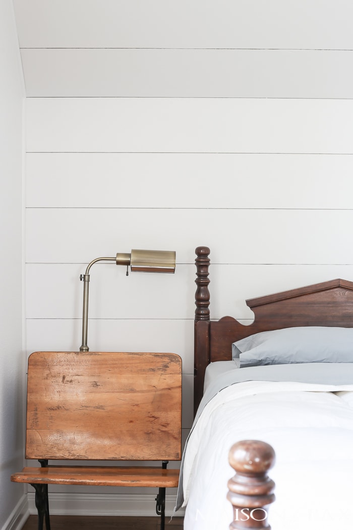 love the plank accent behind this antique bed, such a charming, farmhouse look