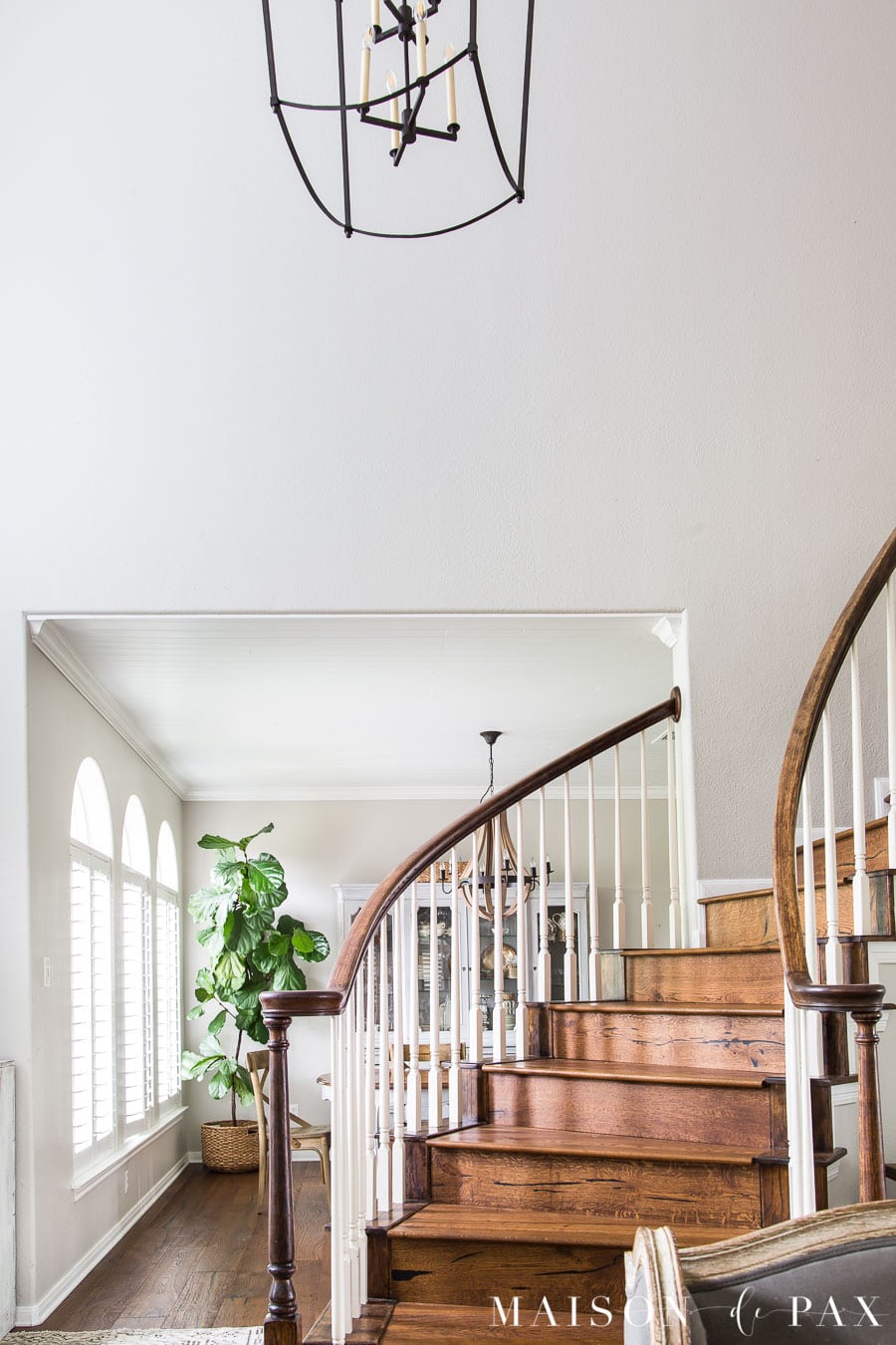two story entryway and stairwell with large black lantern | Maison de Pax