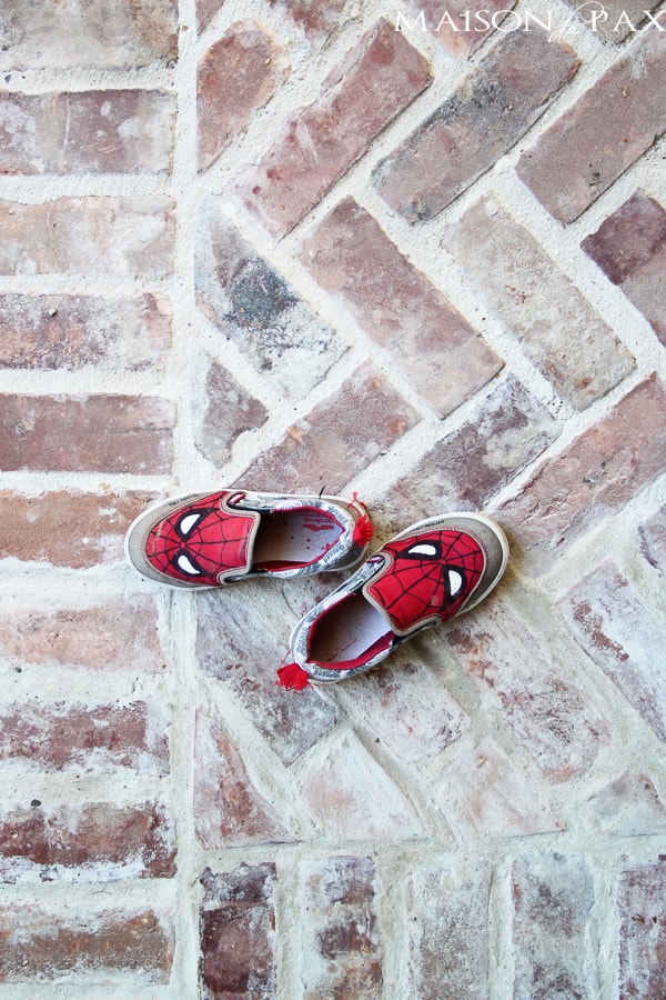 Stamped brick patio with kids shoes- Maison de Pax