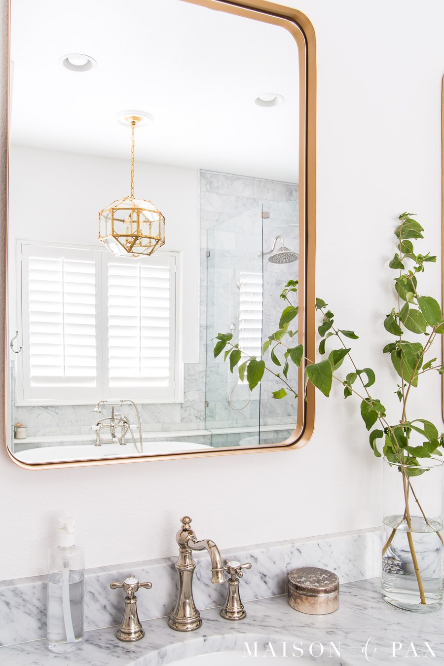 marble countertops and wall tile in bathroom