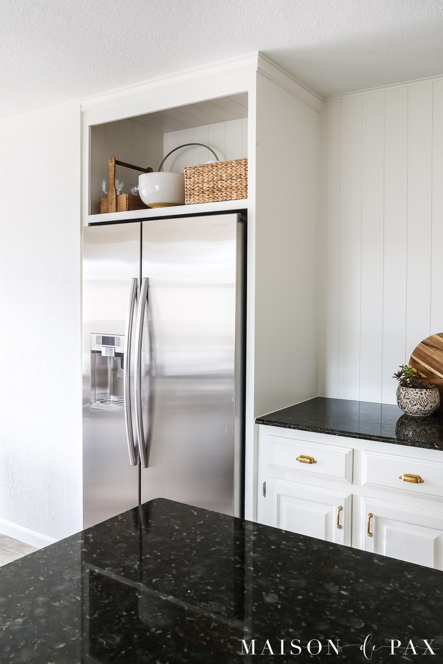 kitchen with over fridge storage in open shelf