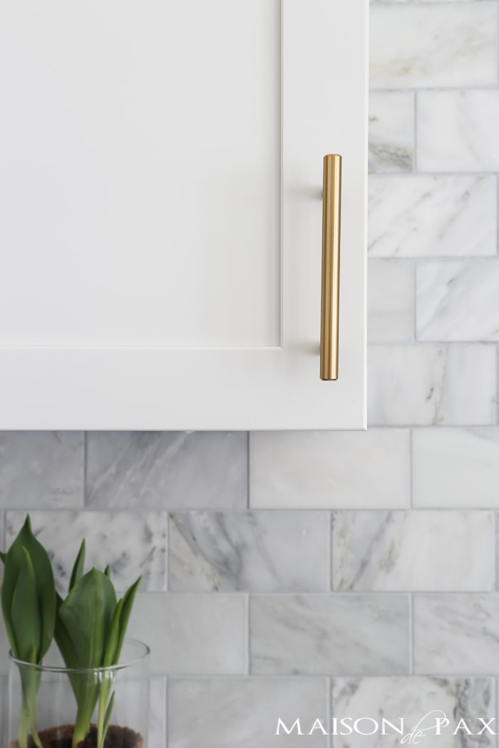 Close up of white cabinets and gold hardware- Maison de Pax