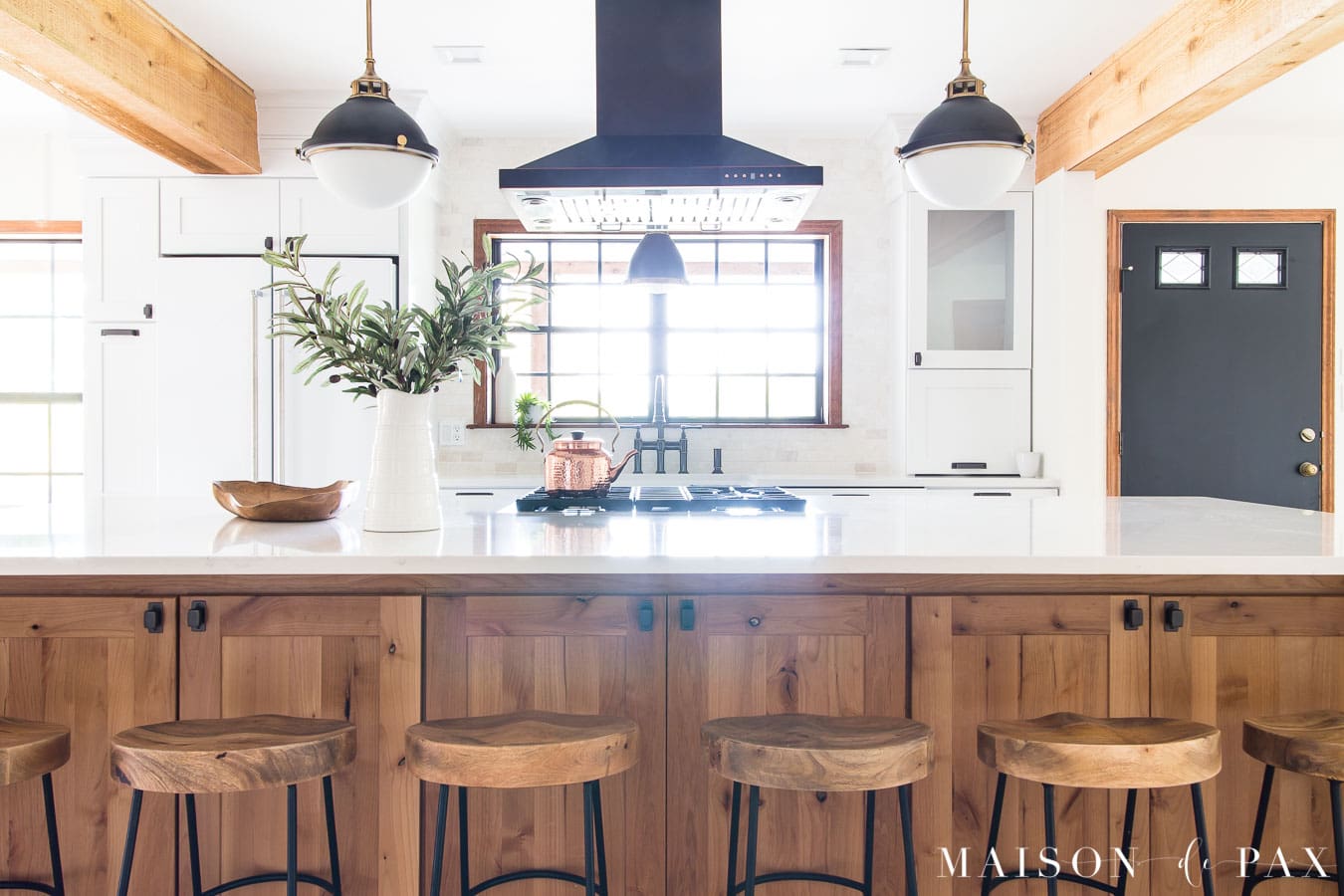 wood island with storage and white marble countertops | Maison de Pax