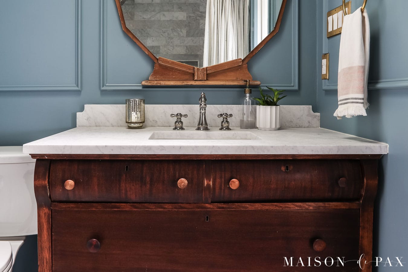 wood vanity with honed cararra marble top