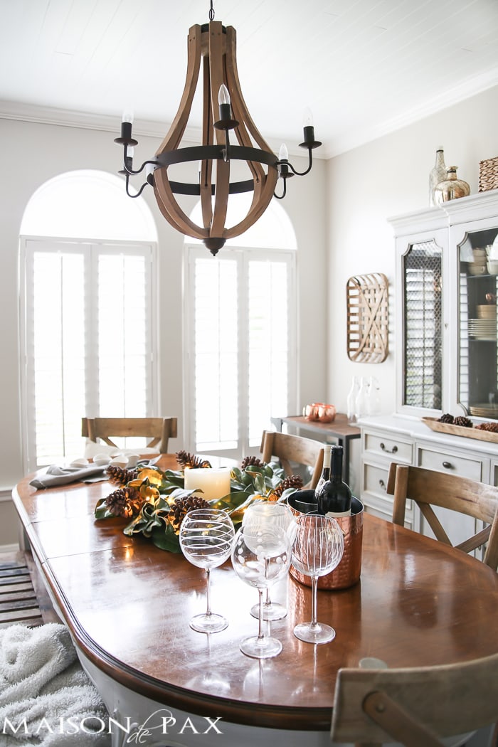 simple greenery and mercury glass makes this French farmhouse style dining room all set for Christmas!