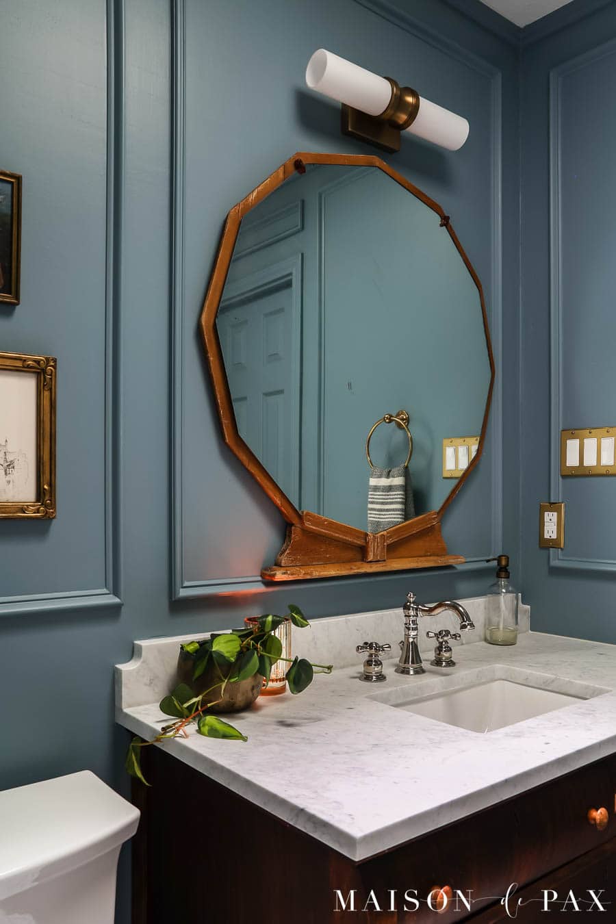 antique dresser vanity with honed carrara countertop and white porcelain sink