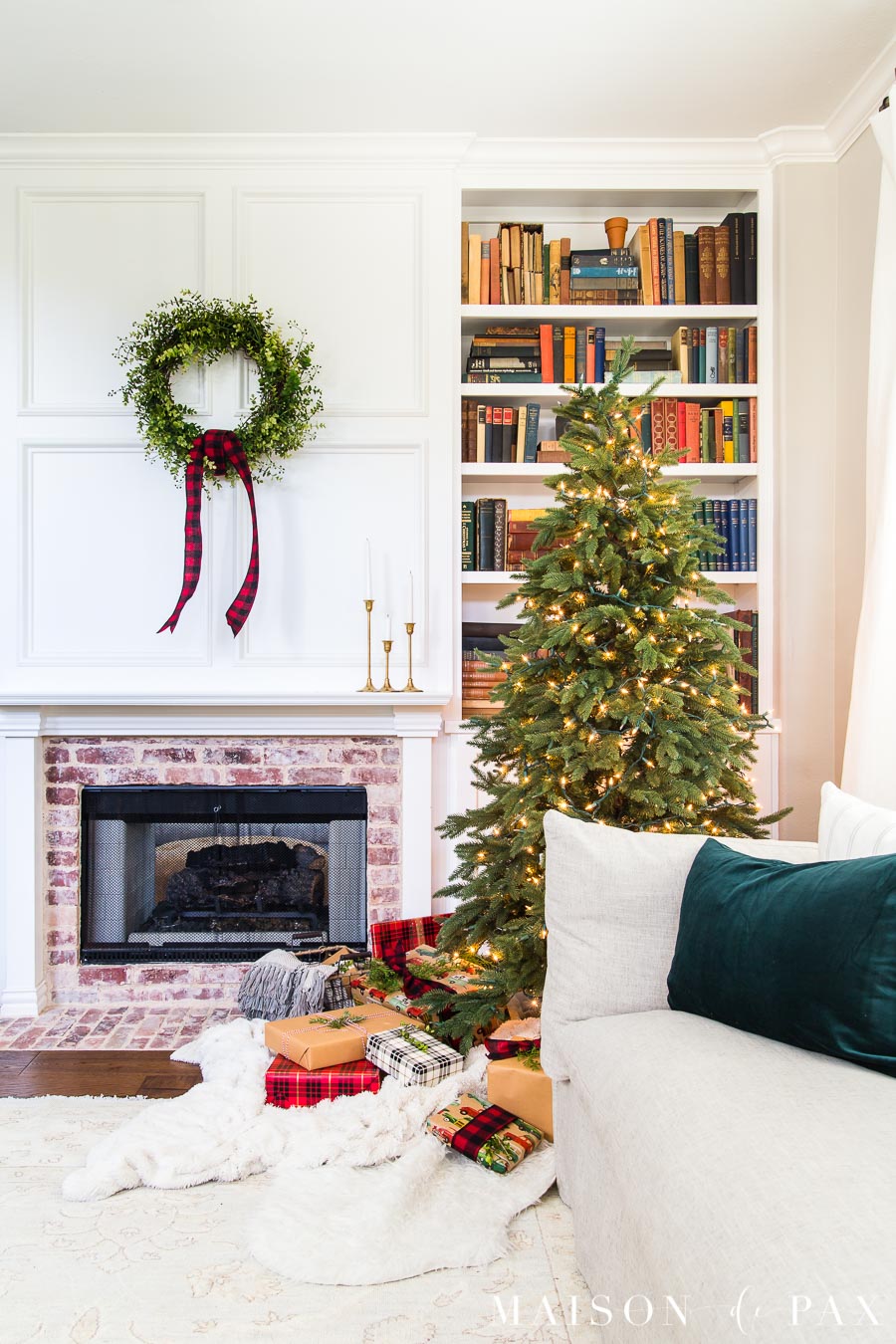 white mantel with simple green wreath and naked tree and red buffalo plaid | Maison de Pax