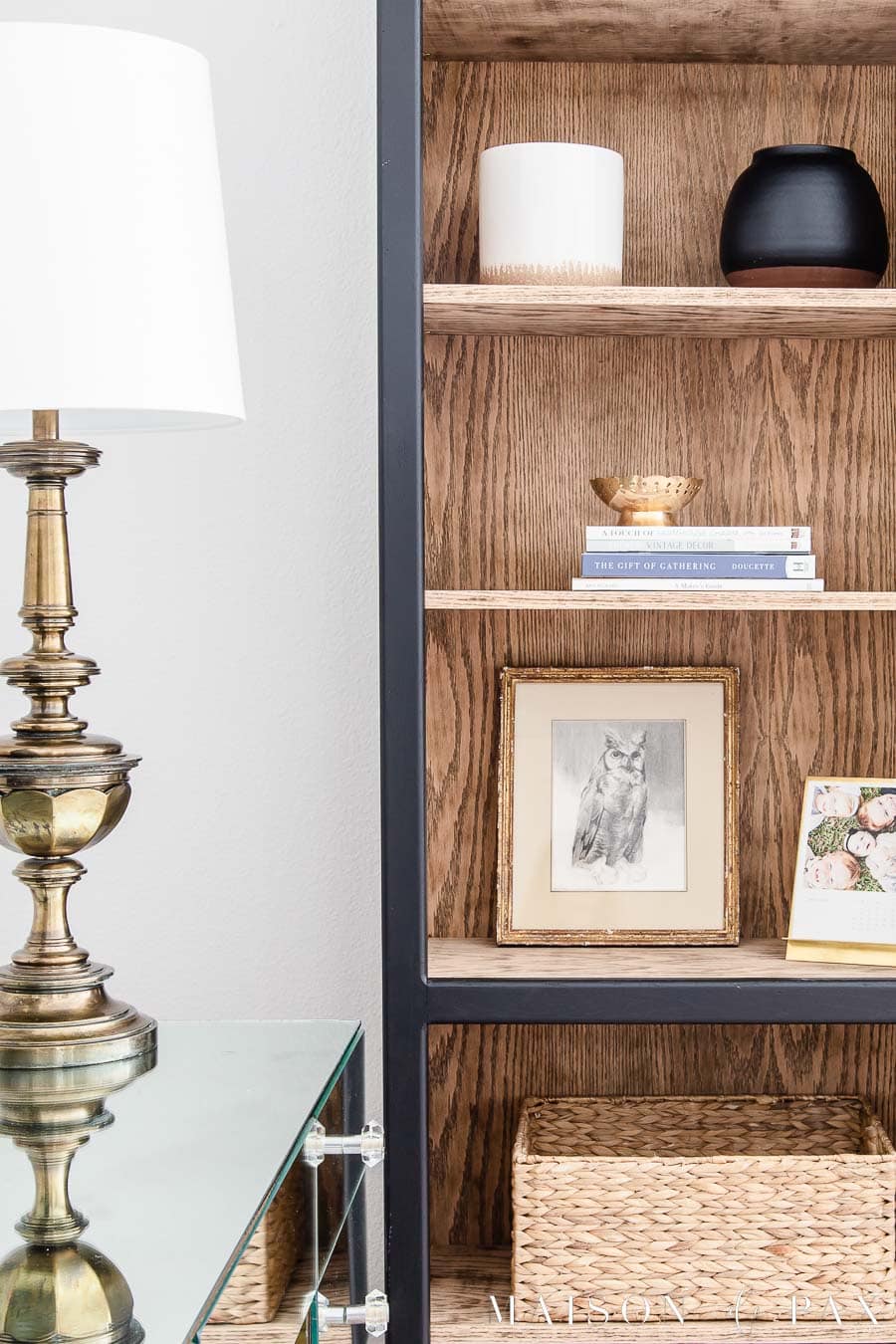office bookcase with vintage unlacquered brass table lamp