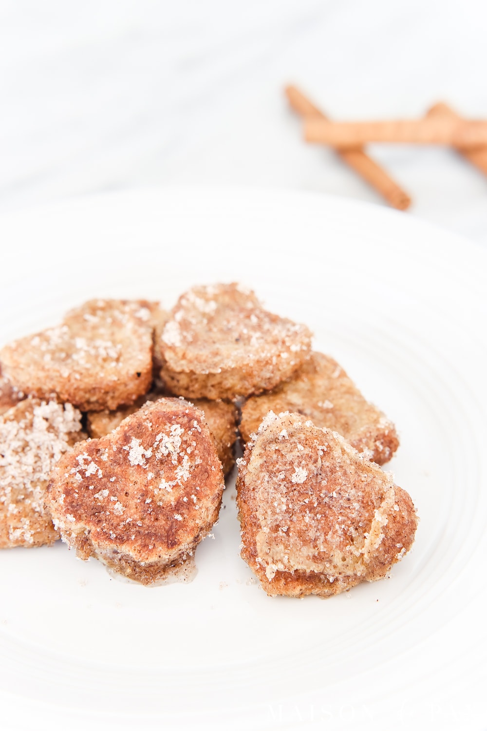 cinnamonan and sugar on heart shaped french toast... valentines recipe #valentinesrecipe #valentinesbreakfast #hearttoast #frenchtoast