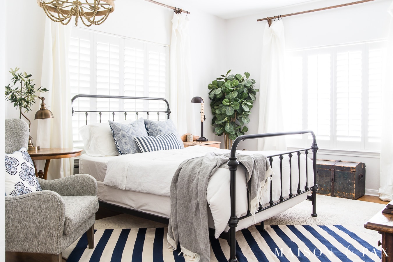navy and white striped rug layered in bedroom- maison de pax