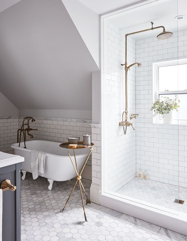 marble hex floors and white clawfoot tub in bathroom 
