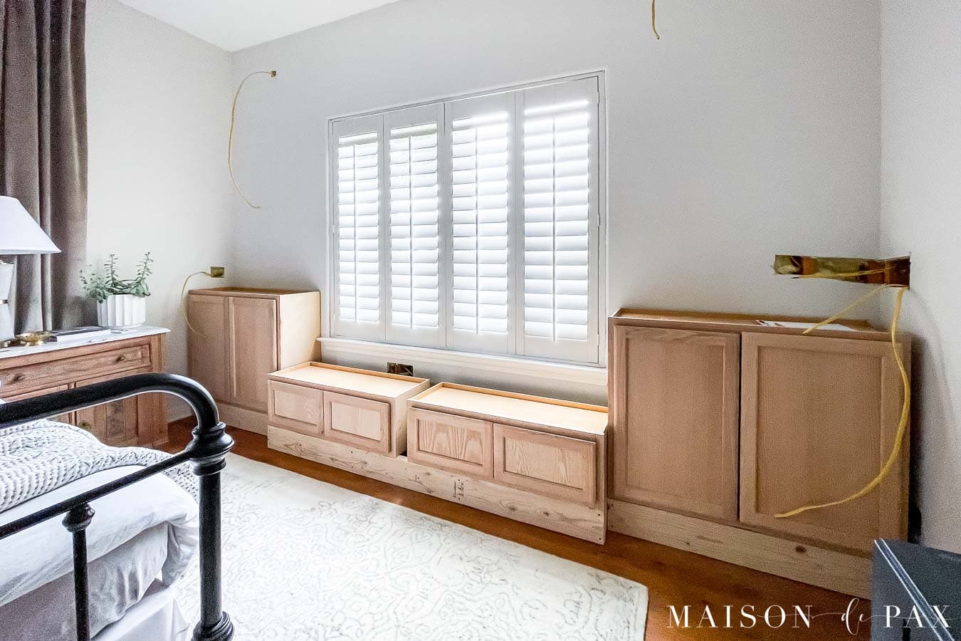 installed cabinets for diy window seat with storage