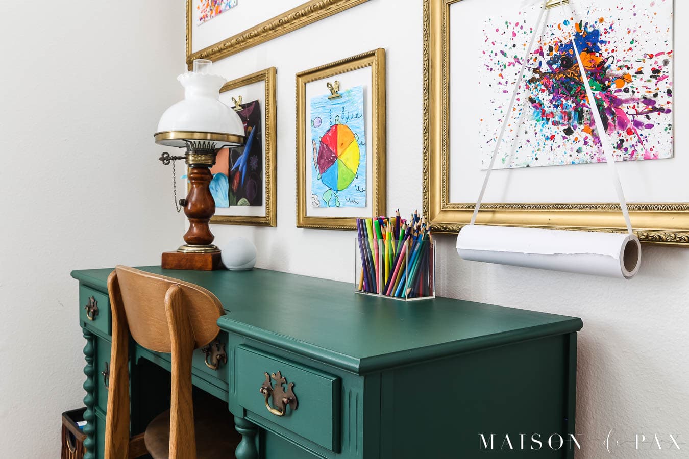 rich green painted desk with wood lamp and wood chair