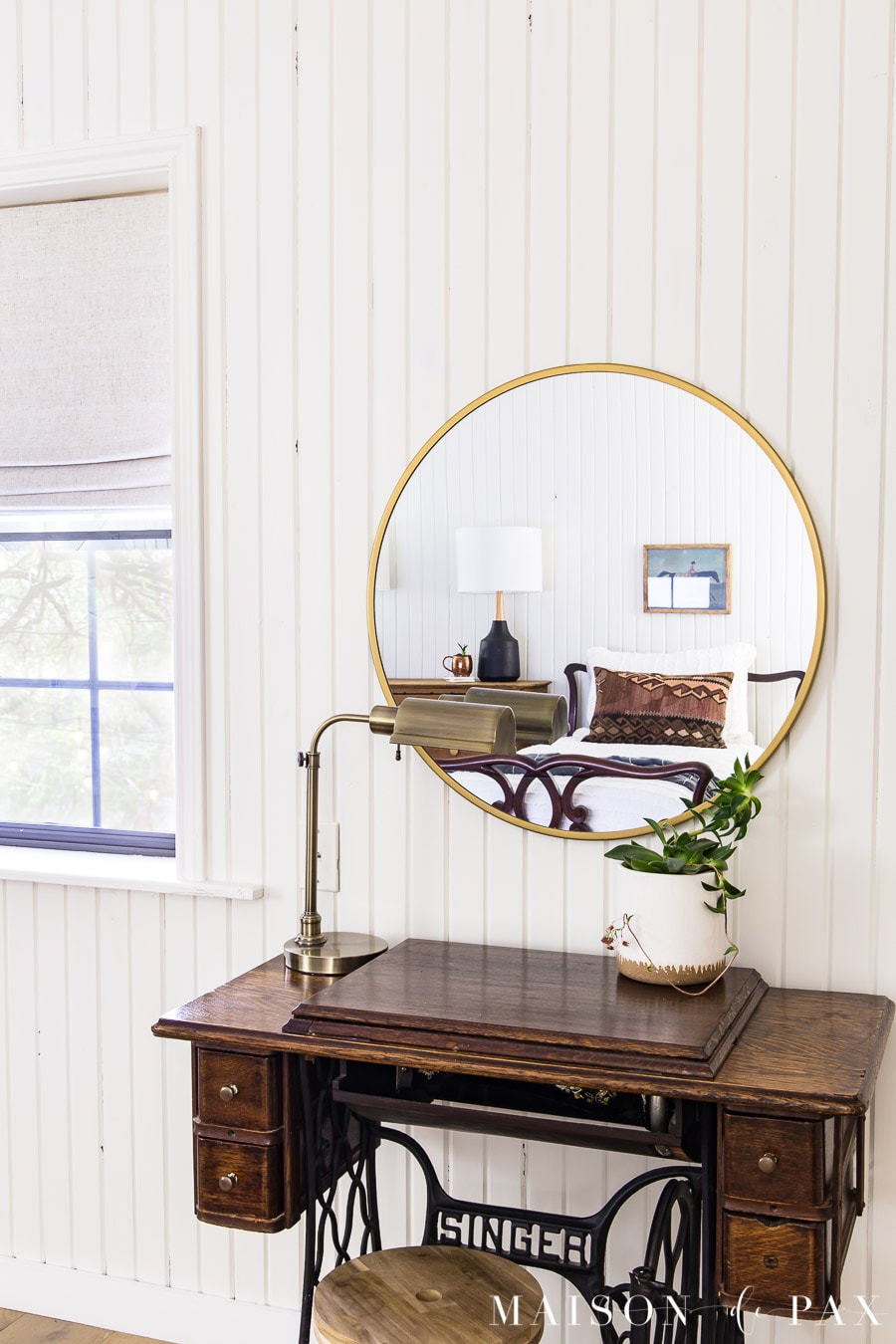 antique sewing machine used as vanity with modern brass mirror | maison de pax