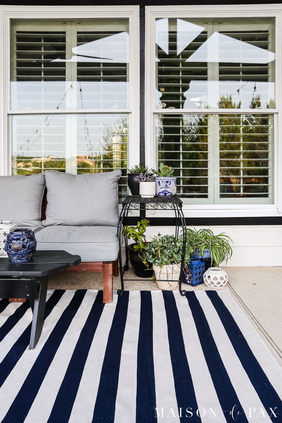 blue and white striped rug and blue and white talavera pottery