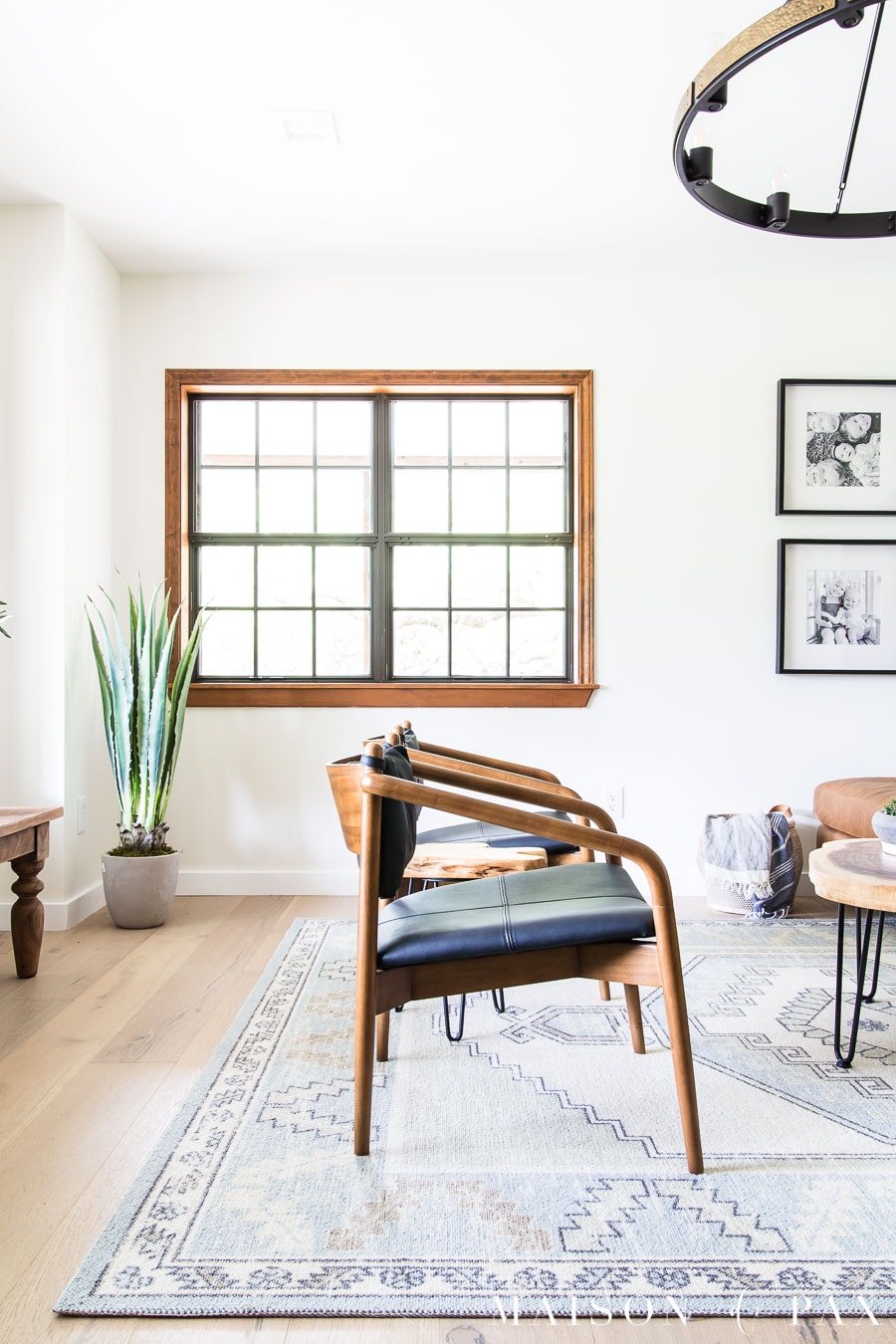 black leather and walnut mid century modern lounge chairs | Maison de Pax
