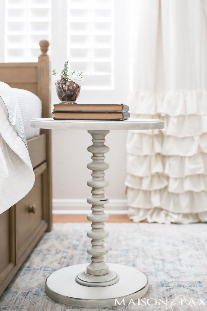 Elegant, neutral little girl room with wood tones and a stenciled accent wall: A gray-washed trundle bed provides the perfect anchor for a gorgeous, neutral yet feminine little girl's room.