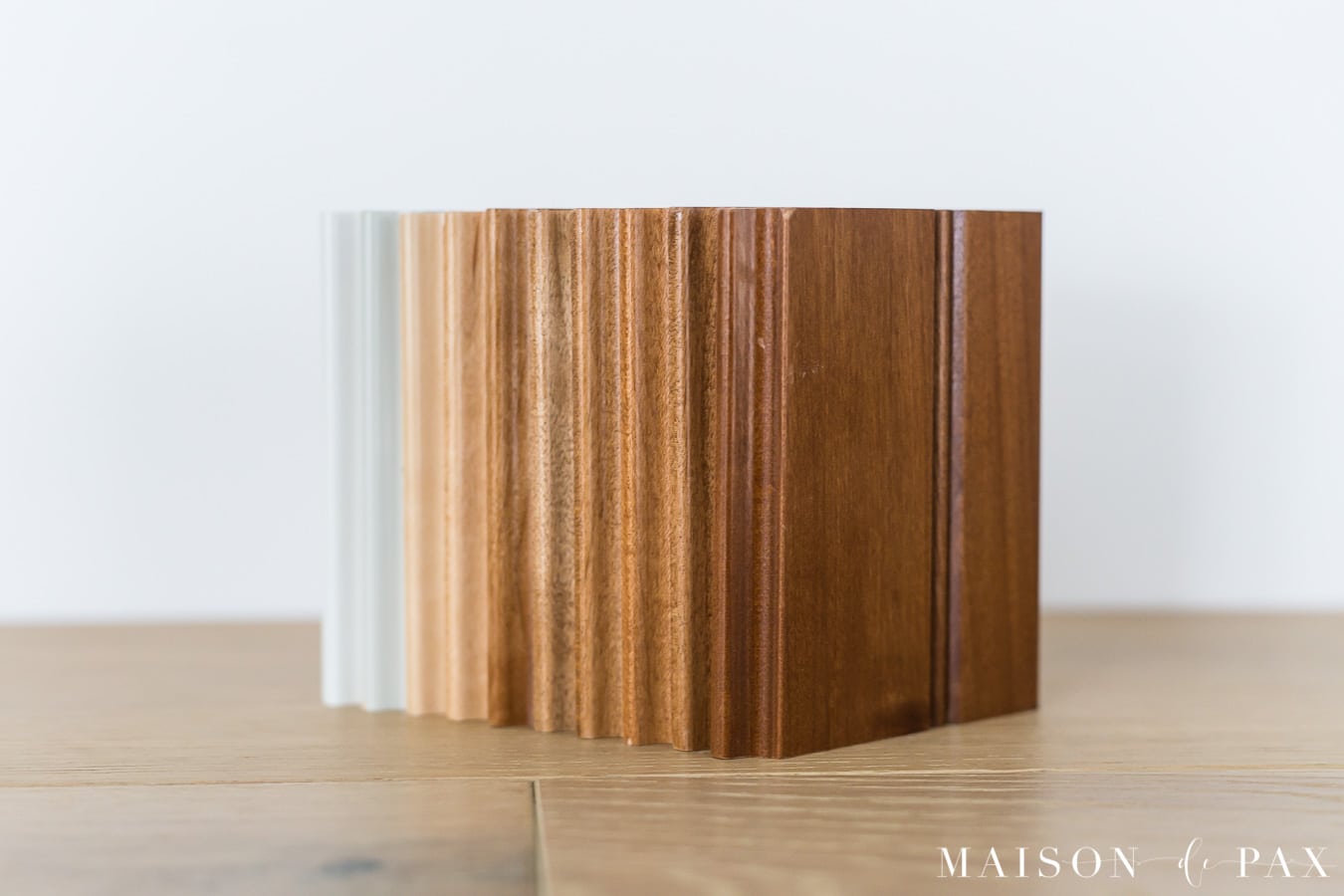 medium wood cabinet samples, light wood cabinet samples, and white cabinet samples all laid out 