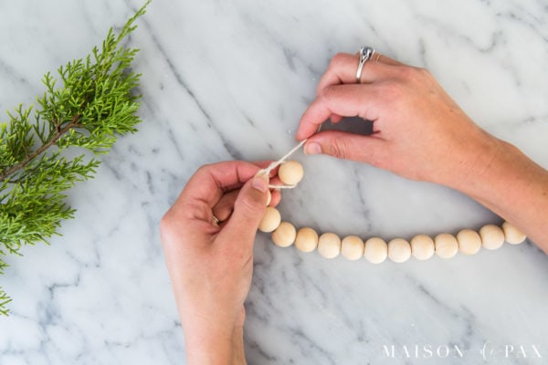 secure final bead for DIY wood bead garland
