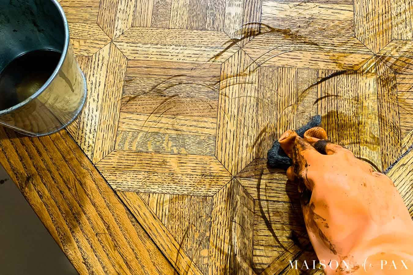 applying chemical stripper to remove old wood stain and varnish | Maison de Pax
