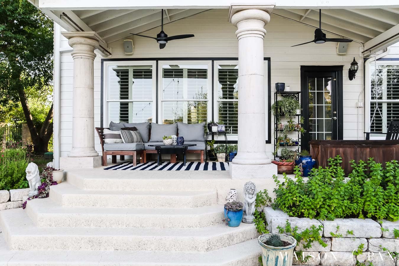 large porch steps with blue and white pots