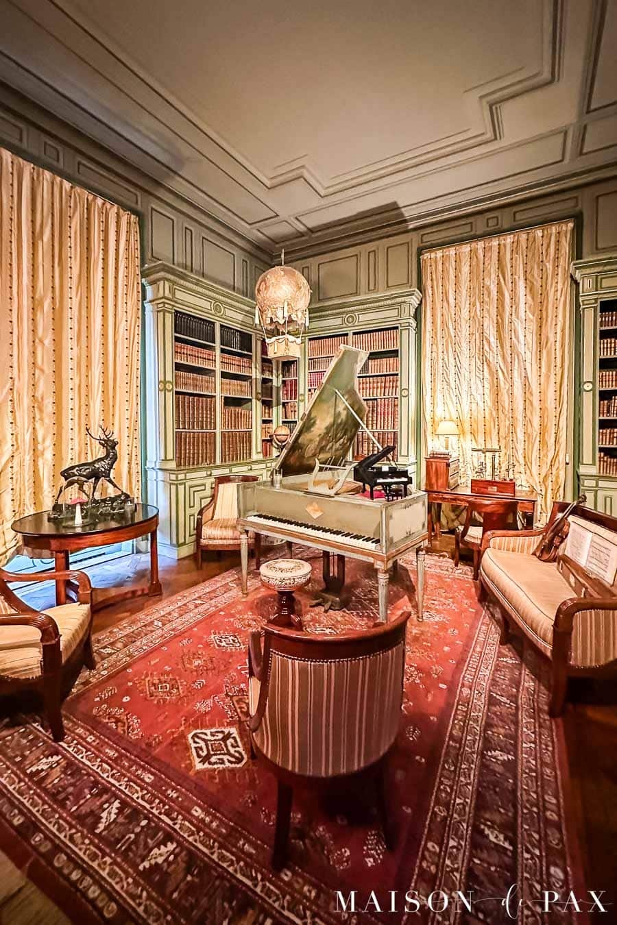 library with elegant trim, paneling, and moulding