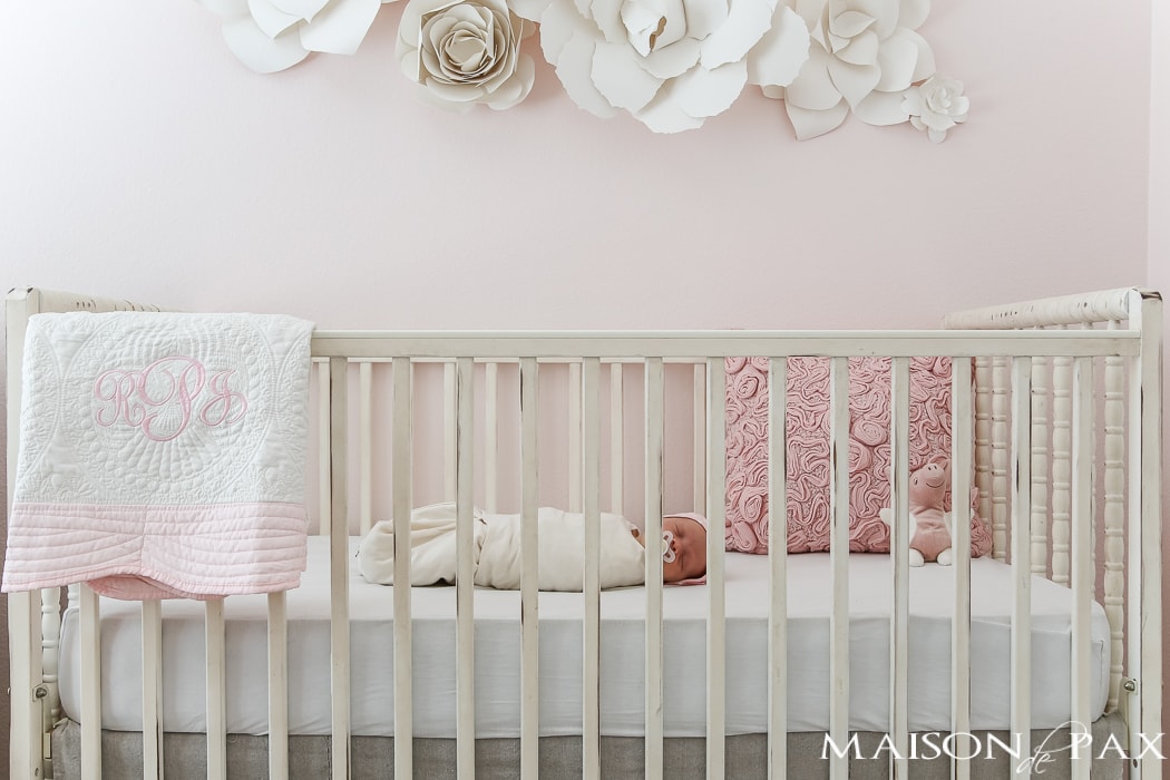 baby girl in painted crib- Maison de Pax