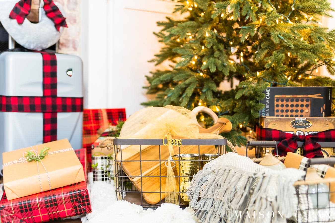 gift baskets and presents wrapped under Christmas tree | Maison de Pax