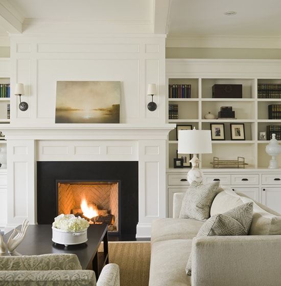 fireplace with white mantel and molding above- Maison de Pax