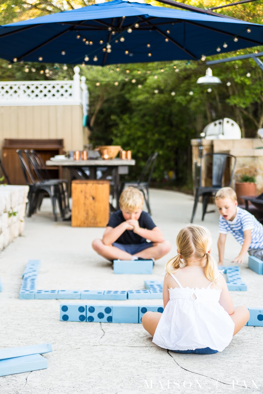 Make giant dominoes and other yard games with your kids: find this and other family projects plus tips for completing project with kids! #familyfun #familyproject #outdoorgames #kidfriendlyproject #diyproject